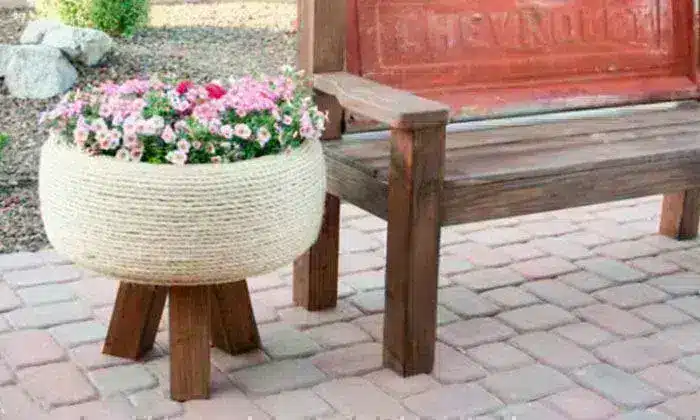20 tire recycling ideas: White planter made from recycled tires