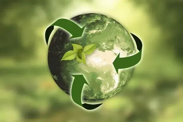 Bola del mundo con simbolo de sostenibilidad y color verde
